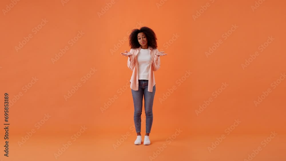 Guilty African American woman waves arms in confusion Guilty African American woman waves arms in confusion