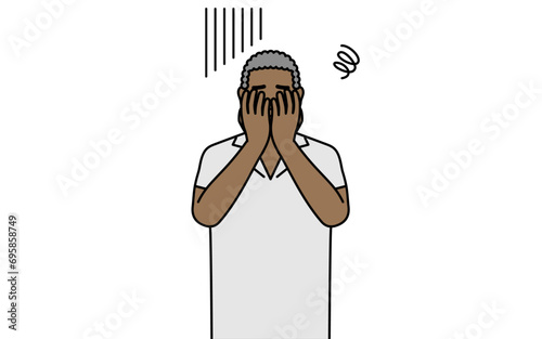 African senior man covering his face in depression. photo