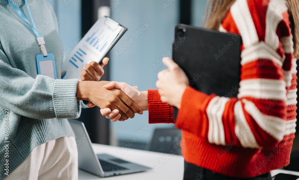 Business partnership handshake concept.Photo two coworkers handshaking process.Successful deal after great meeting..