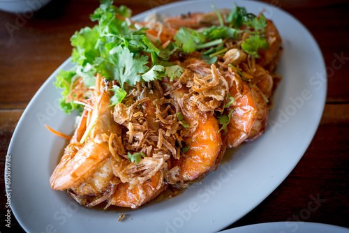 Fried shrimp with tamarind sauce garnish with coriander, Thai food