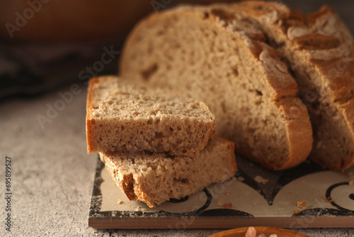 A loaf of rye bread in low key