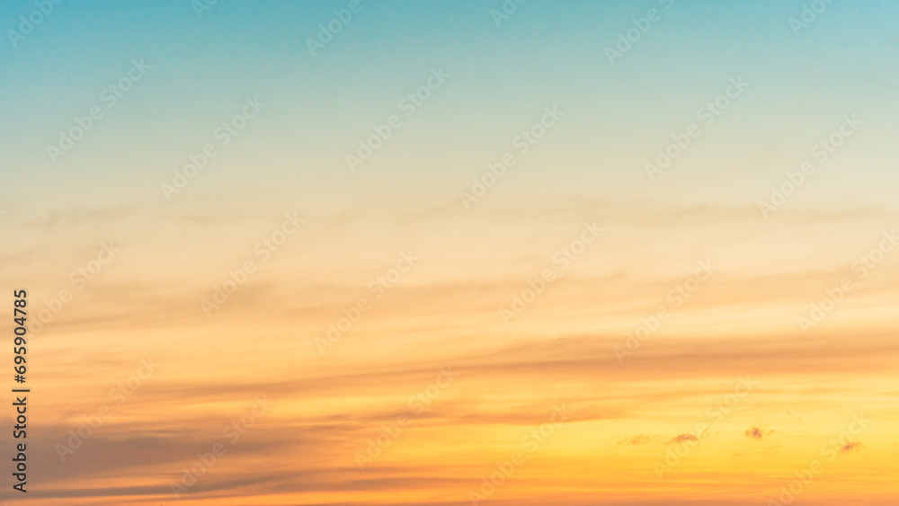 Morning horizon sky with Orange, Yellow sunrise clouds, golden hour and bright sunlight background 
