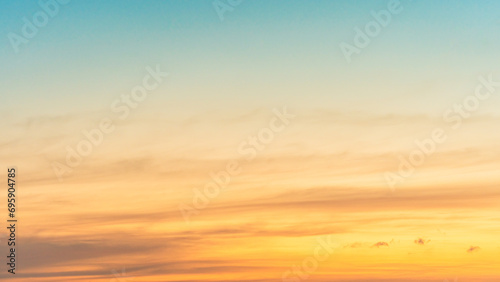 Morning horizon sky with Orange, Yellow sunrise clouds, golden hour and bright sunlight background  #695904785
