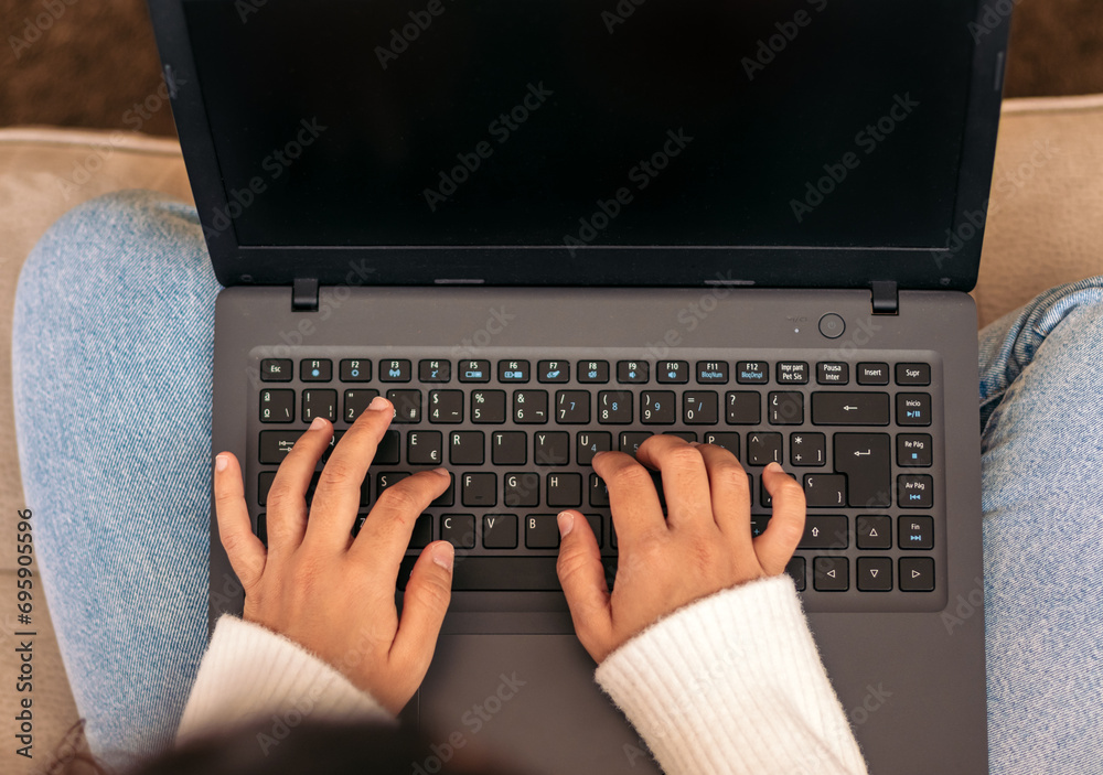 Home Productivity: Unrecognizable Woman Working on Laptop Home Productivity: Unrecognizable Woman Working on Laptop