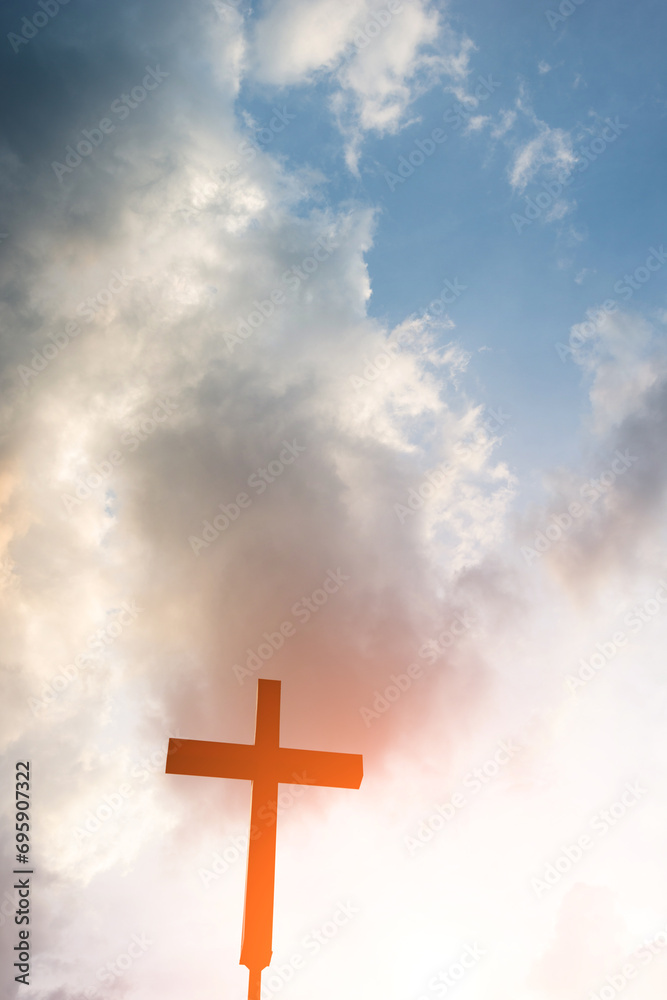 A christian cross under cloudy sky A christian cross under cloudy sky