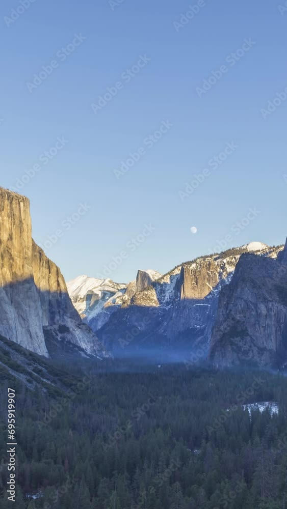 Yosemite Valley Tunnel View at Sunset in Winter. Sunny Evening with Moon. California, USA. Time Lapse. Vertical Video Yosemite Valley Tunnel View at Sunset in Winter. Sunny Evening with Moon. California, USA. Time Lapse. Vertical Video