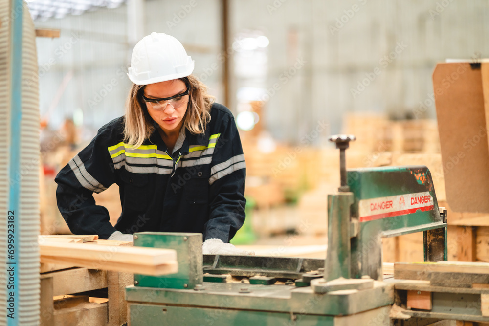 Engineer wearing safety vest controlling industrial machine working, talking with assistant worker checking first for labour with laptop computer, Officer setting a technology system in factory. Engineer wearing safety vest controlling industrial machine working, talking with assistant worker checking first for labour with laptop computer, Officer setting a technology system in factory.