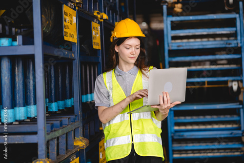 Female engineer using lapto...