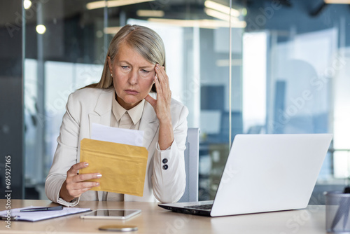 Wallpaper Mural Businesswoman boss received letter mail notification message with bad news, upset and sad senior woman reading news data , female worker inside office at workplace. Torontodigital.ca