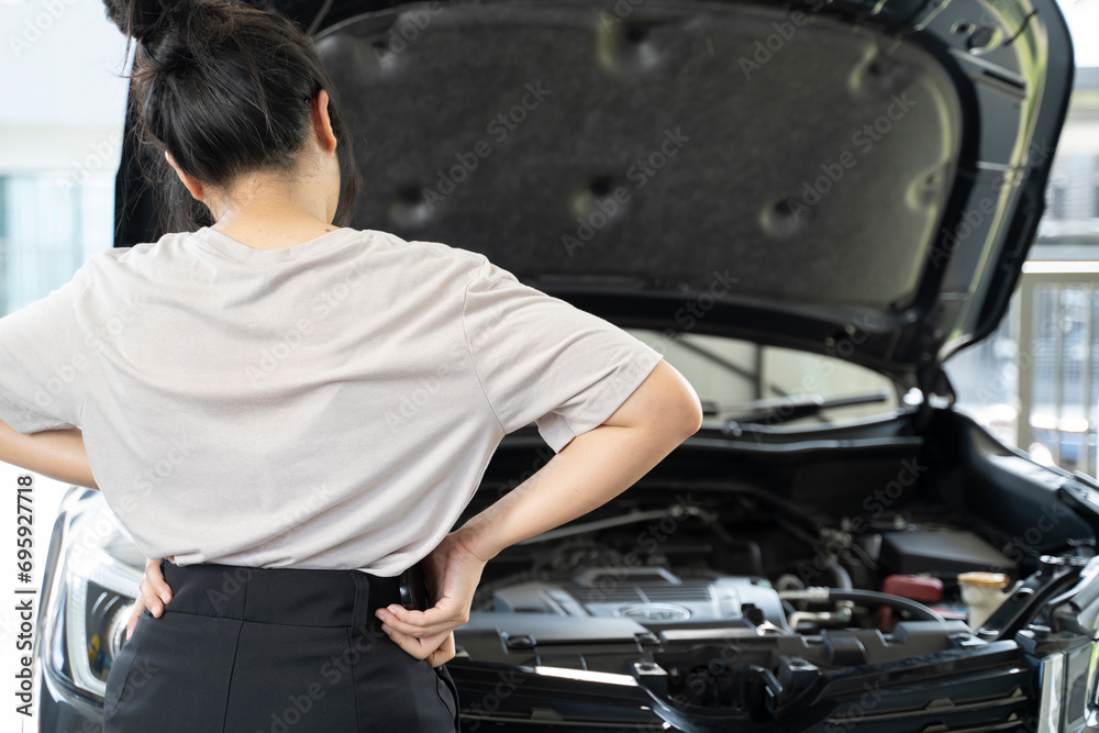 A woman having car problems is calling to consult with an expert. A woman having car problems is calling to consult with an expert.
