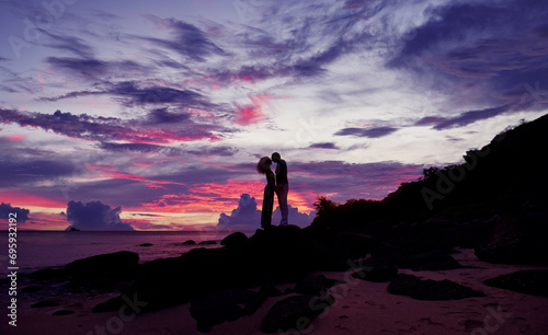 Romantic silhouette of a loving couple on honeymoon