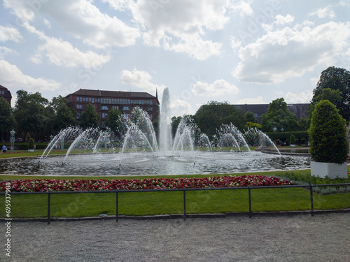 lively central square with lawns and fountains, as well as beautiful architectural buildings in Mannheim, Germany