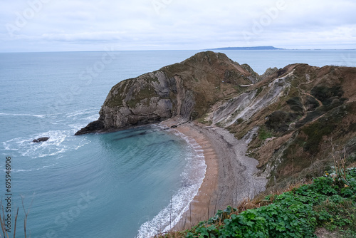 Man O'War Beach and Durdle Door on Jurassic Coast, Dorset, England. Scenic bay surrounded by Jurassic Coast rocks. Winter or autumn days. beautiful landscape and seascape view. English Channel. UK