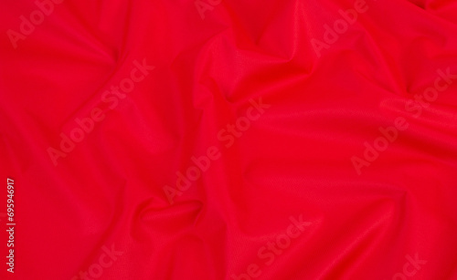 Background of crumpled red fabric