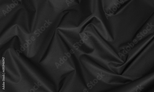 Background of crumpled black fabric © Valeria F