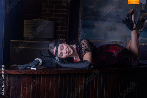 Roaring 20's flappers in basement speakeasy bar