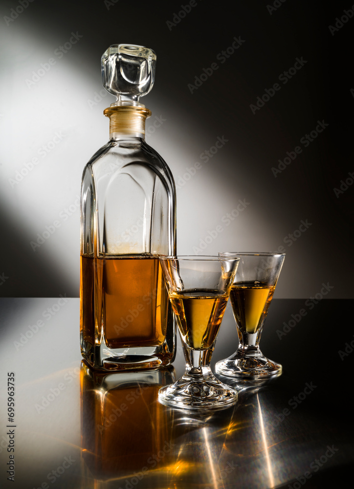 Still-life with shot glasses and bottle of liquor Still-life with shot glasses and bottle of liquor