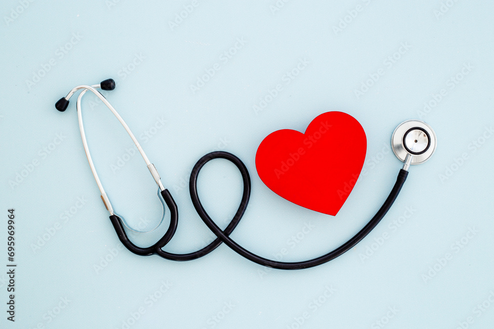 Medical stethoscope and red heart, top view. Health care and heart check concept Medical stethoscope and red heart, top view. Health care and heart check concept