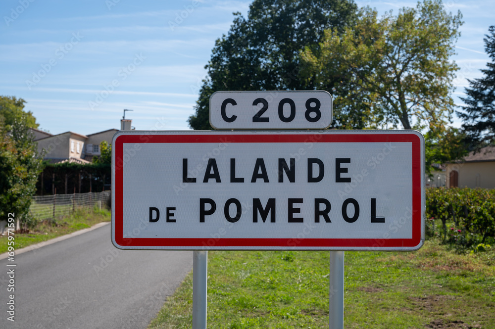 City road sign Lalande de Pomerol near Saint-Emilion wine making region, growing of Merlot or Cabernet Sauvignon red wine grapes, France, Bordeaux