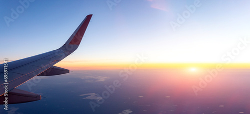 Airplane Wing Soaring Through the Sky. Banner copy space