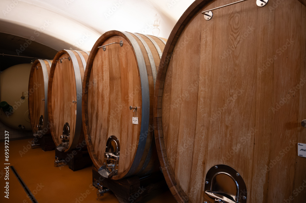 Wooden barrels. Production of cremant sparkling wine in south part of Luxembourg country on bank of Moezel, also known as Mosel, Moselle or Musel river.