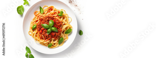 Top view of Italian pasta with tomato and basil in a white plate on a white background.