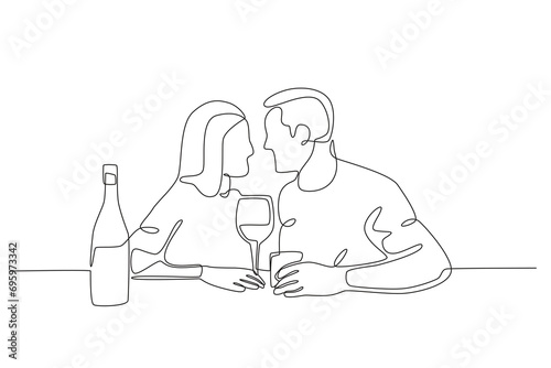 A couple looked at each other at dinner. Candle light dinner one-line drawing