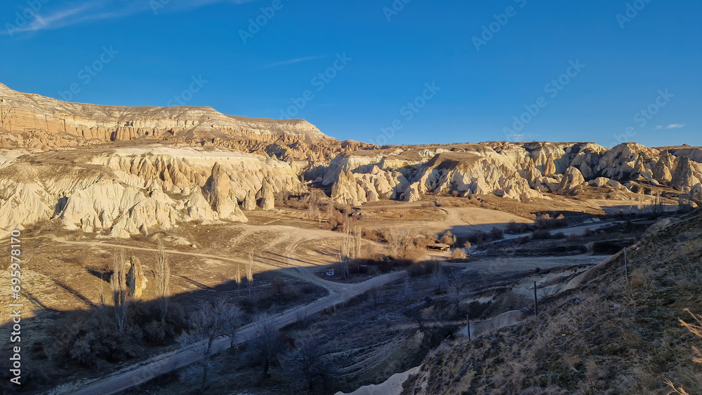Nature's Tapestry: Cappadocia's rugged terrain, a testament to time and tumultuous tales.