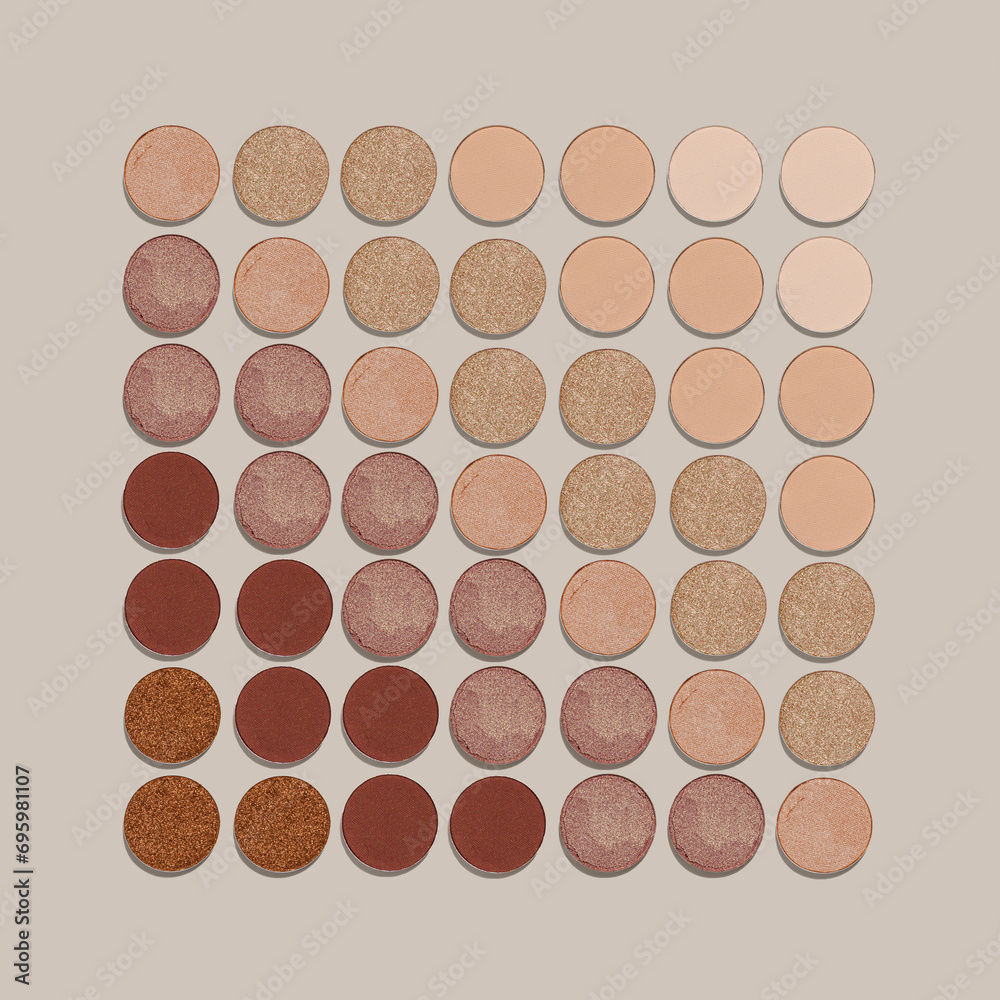 Square Pattern of color gradient swatches of eye shadows on neutral colored background. Beige brown skintone natural color eyeshadow powder, shiny an matte, minimal aesthetic photo, top view Square Pattern of color gradient swatches of eye shadows on neutral colored background. Beige brown skintone natural color eyeshadow powder, shiny an matte, minimal aesthetic photo, top view