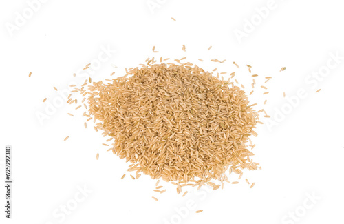 Brown rice lies on an isolated background