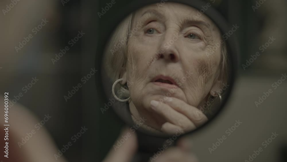 Worried Grandmother Commuting Alone in Trainstation Feeling Stressed Worried Grandmother Commuting Alone in Trainstation Feeling Stressed