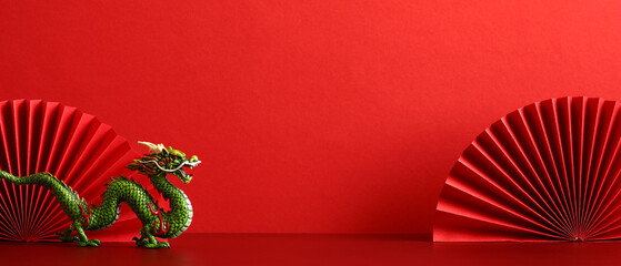 Happy Chinese New Year banner template. Red paper fans with dragon on red background. Traditional holiday Lunar New Year. Happy New Year of the Dragon.