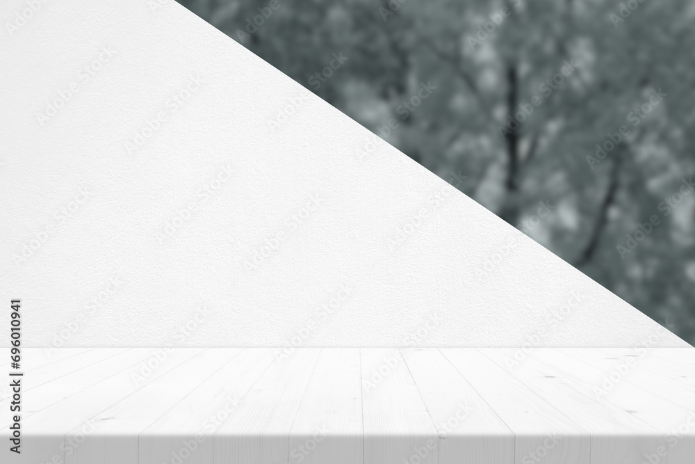 White Wooden Table with Concrete Wall and Blurred Garden Background, Suitable for Product Presentation Backdrop, Display, and Mock up. White Wooden Table with Concrete Wall and Blurred Garden Background, Suitable for Product Presentation Backdrop, Display, and Mock up.