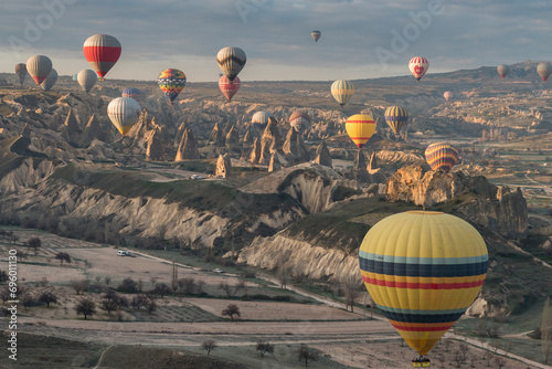 view from a hot air balloon on the several balloons over the beautiful landscape of Cappadocia Göreme, Turkey, 