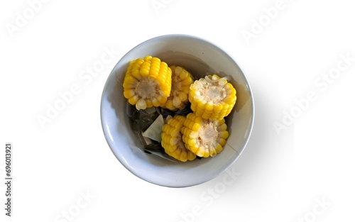 corn in a bowl on a white background