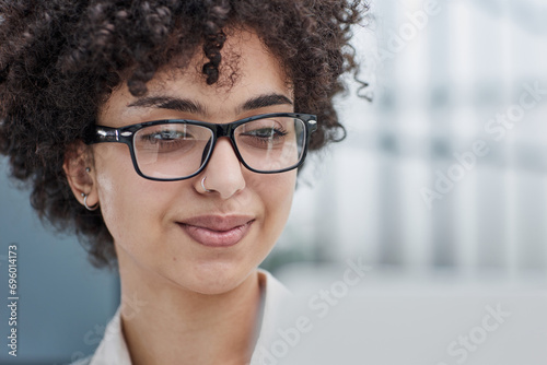 Young Stylish Female with Curly Hair Using Laptop