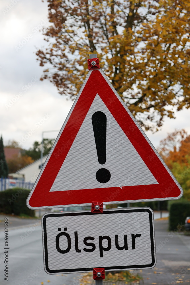 Traffic sign - Warning danger zone with additional sign: oil slick Traffic sign - Warning danger zone with additional sign: oil slick