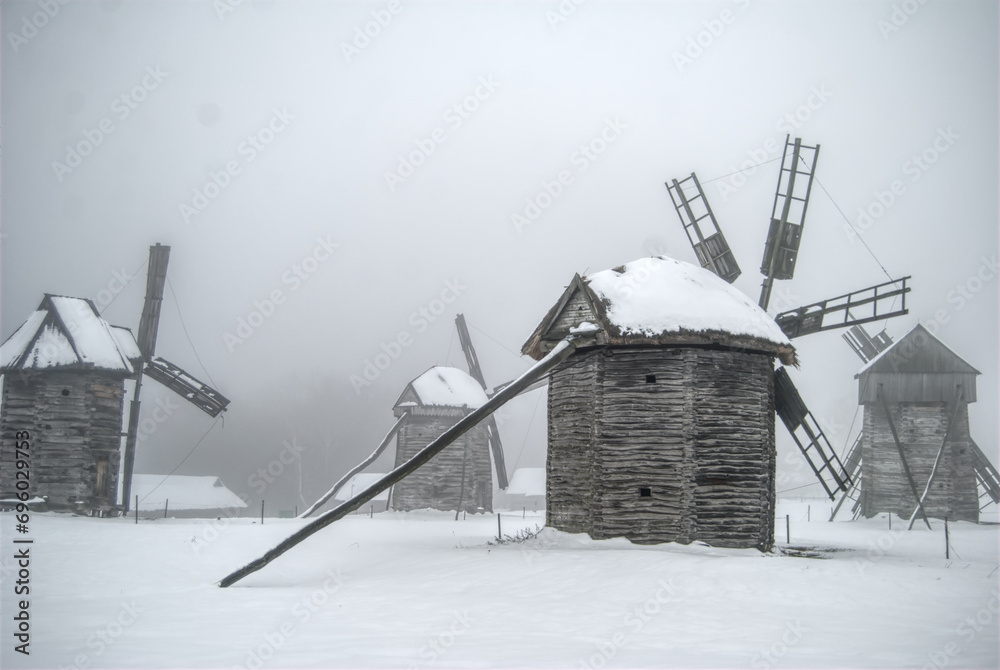 traditional windmills buildings in deep snow in folk museum in Kyiv Ukraine