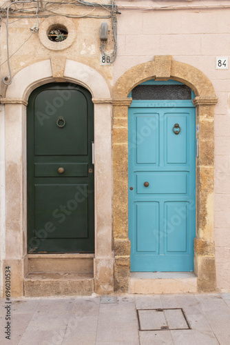 Two doors facade of old town in Polignano a Mare