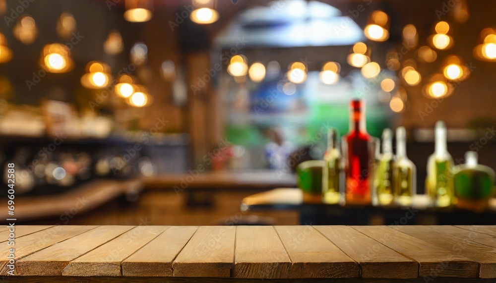 defocused background and bottles of restaurant bar or cafeteria background wooden table top for product display