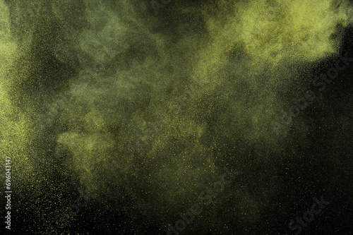 Yellow color texture. Smoke grunge backdrop. Light sky cloud. Gold powder explosion on black background.	
