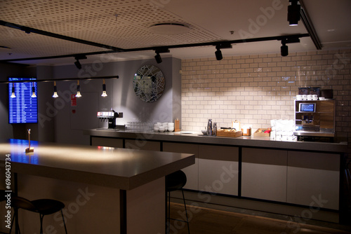 COPENHAGEN, DENMARK - NOV 24, 2018: Self-service drinks bar and snacks in a Scandinavian-style airport lounge