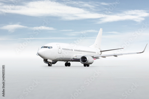 White passenger airplane isolated on bright background with sky