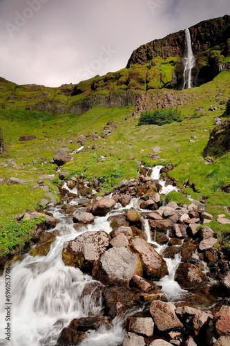 Bjarnafoss waterall falling over the mountain edgetryside photo