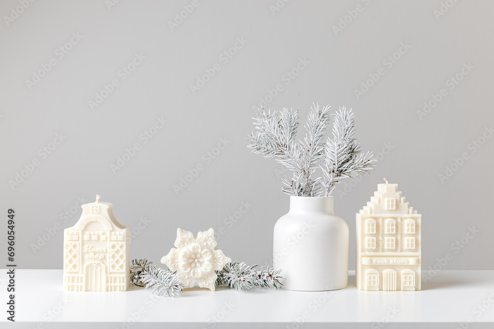 Christmas and New Year composition. Christmas fir tree branches, gifts, pine cones on wooden white rustic background. Flat lay, top view. Copy space. Banner backdrop. Scandinavian houses and candles Christmas and New Year composition. Christmas fir tree branches, gifts, pine cones on wooden white rustic background. Flat lay, top view. Copy space. Banner backdrop. Scandinavian houses and candles