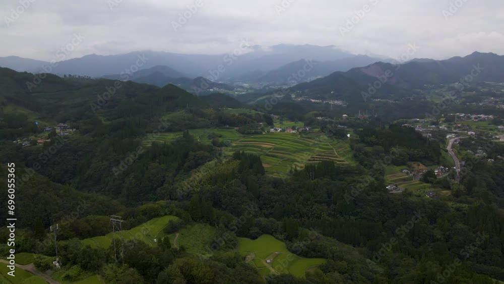 Aerial shot of rice terrace on hillside in mountain of Kumamoto prefecture in Japan Aerial shot of rice terrace on hillside in mountain of Kumamoto prefecture in Japan