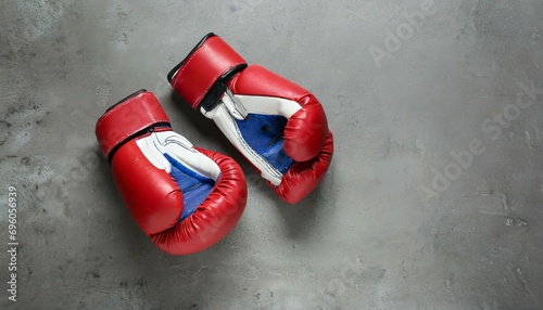 pair of boxing gloves on grey background space for text © Nathaniel