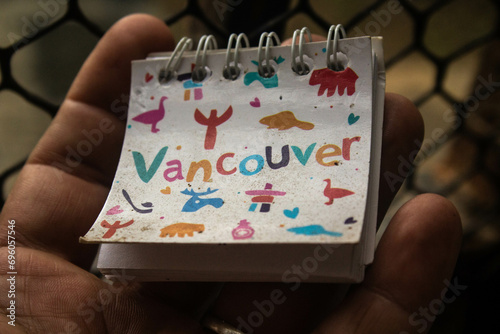A mini notepad with the word vancouver which is a Canadian city