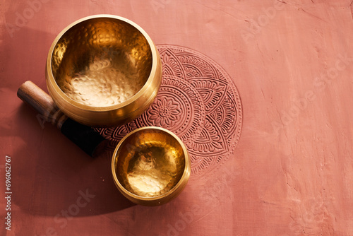 A close up of a tibetan singing bowl or himalayan bowl for therapy, meditation and relaxation. photo