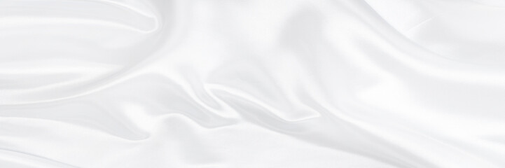 White gray satin texture that is white silver fabric silk background with beautiful soft blur pattern natural.